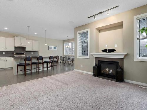 805 Armitage Wynd, Edmonton, AB - Indoor Photo Showing Living Room With Fireplace