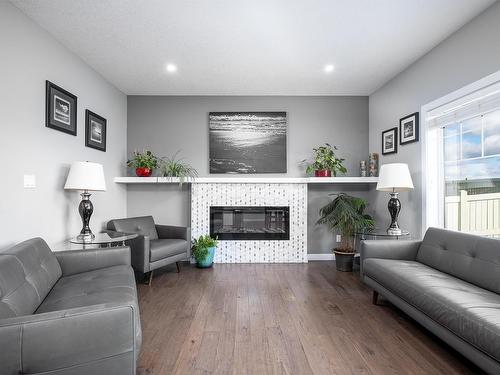 4723 35 Street, Beaumont, AB - Indoor Photo Showing Living Room With Fireplace