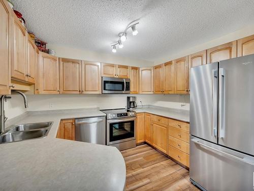 220 13635 34 Street, Edmonton, AB - Indoor Photo Showing Kitchen With Stainless Steel Kitchen With Double Sink