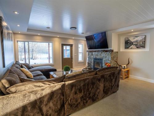 21 54514 Rge Rd 12, Rural Lac Ste. Anne County, AB - Indoor Photo Showing Living Room With Fireplace