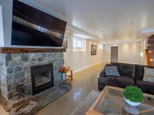 21 54514 Rge Rd 12, Rural Lac Ste. Anne County, AB - Indoor Photo Showing Living Room With Fireplace