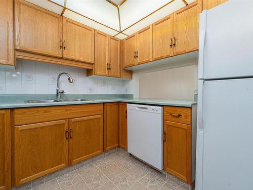 212 9926 100 Avenue, Fort Saskatchewan, AB - Indoor Photo Showing Kitchen With Double Sink