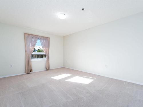 212 9926 100 Avenue, Fort Saskatchewan, AB - Indoor Photo Showing Other Room