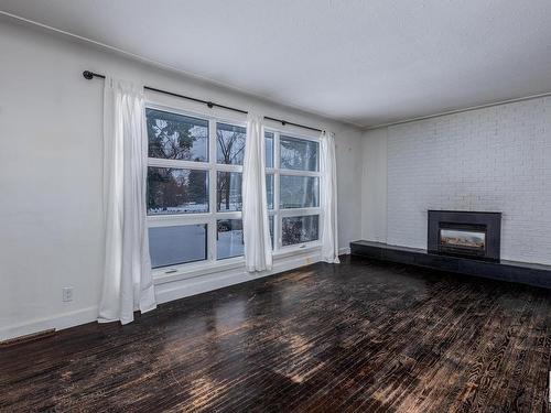 8932 142 Street, Edmonton, AB - Indoor Photo Showing Living Room With Fireplace