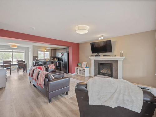 401 Songhurst Place, Leduc, AB - Indoor Photo Showing Living Room With Fireplace