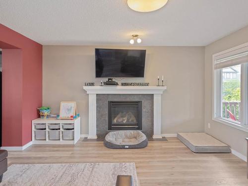 401 Songhurst Place, Leduc, AB - Indoor Photo Showing Living Room With Fireplace