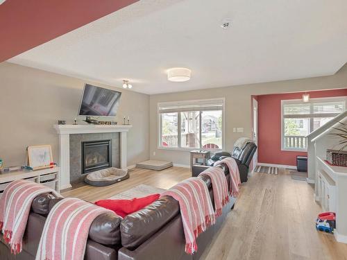 401 Songhurst Place, Leduc, AB - Indoor Photo Showing Living Room With Fireplace