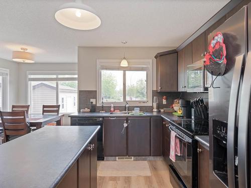 401 Songhurst Place, Leduc, AB - Indoor Photo Showing Kitchen With Double Sink