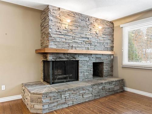 8111 145 Street, Edmonton, AB - Indoor Photo Showing Living Room With Fireplace