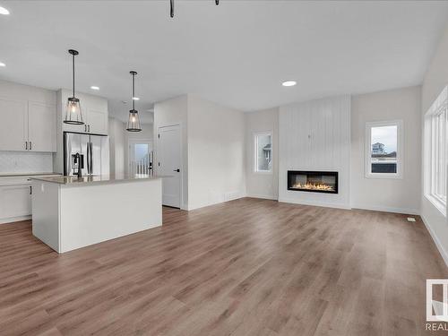 10 Brickyard Way, Stony Plain, AB - Indoor Photo Showing Kitchen With Fireplace With Upgraded Kitchen