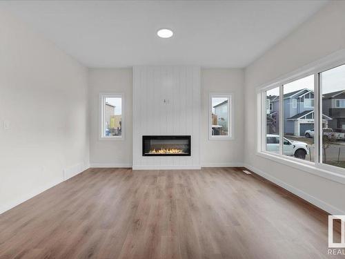 10 Brickyard Way, Stony Plain, AB - Indoor Photo Showing Living Room With Fireplace