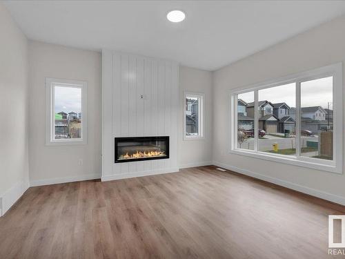 10 Brickyard Way, Stony Plain, AB - Indoor Photo Showing Living Room With Fireplace