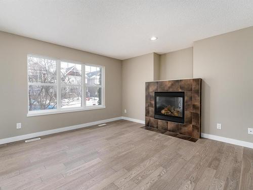 116 61 Street, Edmonton, AB - Indoor Photo Showing Living Room With Fireplace