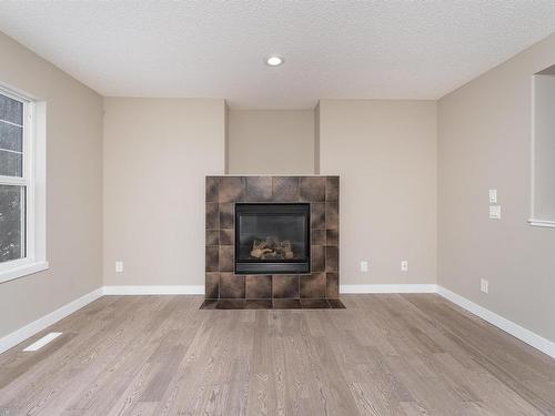 116 61 Street, Edmonton, AB - Indoor Photo Showing Living Room With Fireplace