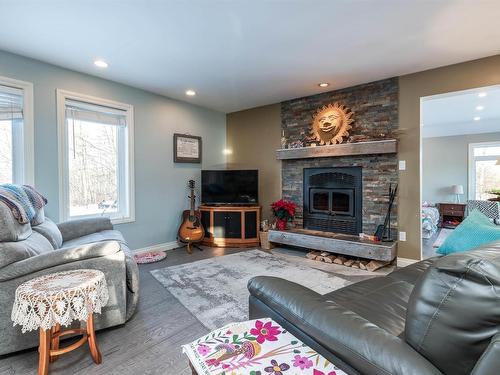 121 20212 Twp Road 510, Rural Strathcona County, AB - Indoor Photo Showing Living Room With Fireplace