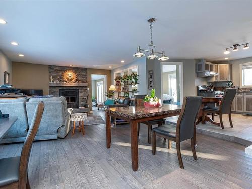 121 20212 Twp Road 510, Rural Strathcona County, AB - Indoor Photo Showing Dining Room With Fireplace