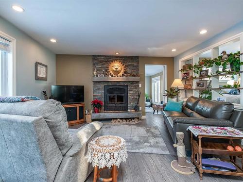 121 20212 Twp Road 510, Rural Strathcona County, AB - Indoor Photo Showing Living Room With Fireplace