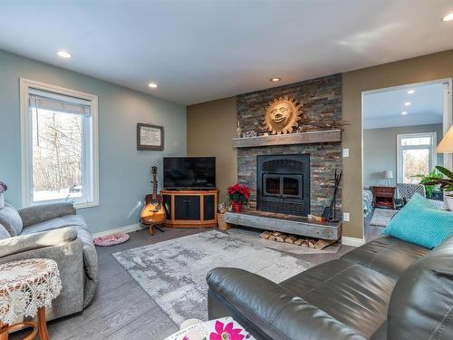 121 20212 Twp Road 510, Rural Strathcona County, AB - Indoor Photo Showing Living Room With Fireplace