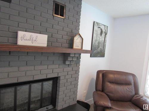 303 57312 Range Road 25, Rural Barrhead County, AB - Indoor With Fireplace