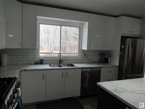 303 57312 Range Road 25, Rural Barrhead County, AB - Indoor Photo Showing Kitchen With Double Sink