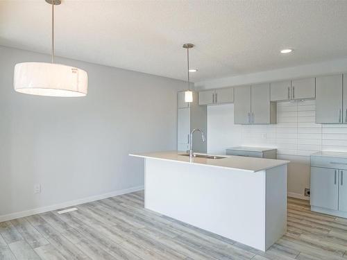 82 50 Mclaughlin Drive, Spruce Grove, AB - Indoor Photo Showing Kitchen With Double Sink