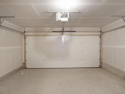 82 50 Mclaughlin Drive, Spruce Grove, AB - Indoor Photo Showing Garage