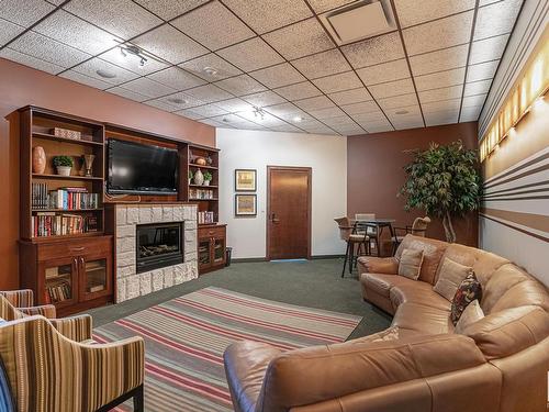 224 10142 111 Street, Edmonton, AB - Indoor Photo Showing Living Room With Fireplace