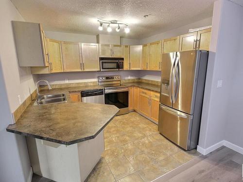 229 300 Spruce Ridge Road, Spruce Grove, AB - Indoor Photo Showing Kitchen With Double Sink