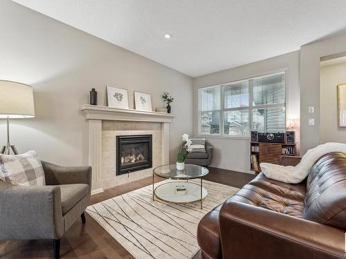 3420 Abbott Way, Edmonton, AB - Indoor Photo Showing Living Room With Fireplace