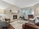 3420 Abbott Way, Edmonton, AB  - Indoor Photo Showing Living Room With Fireplace 