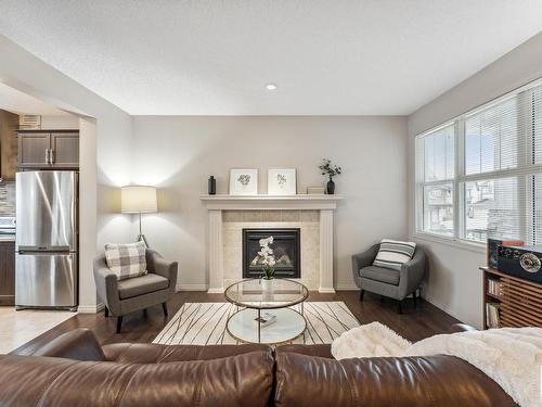 3420 Abbott Way, Edmonton, AB - Indoor Photo Showing Living Room With Fireplace