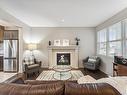 3420 Abbott Way, Edmonton, AB  - Indoor Photo Showing Living Room With Fireplace 