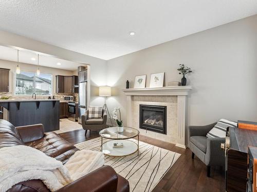 3420 Abbott Way, Edmonton, AB - Indoor Photo Showing Living Room With Fireplace