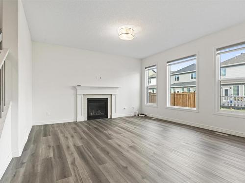 1635 16 St, Edmonton, AB - Indoor Photo Showing Living Room With Fireplace