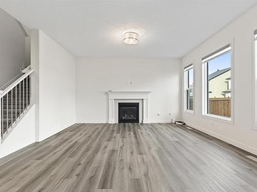 1635 16 St, Edmonton, AB - Indoor Photo Showing Living Room With Fireplace