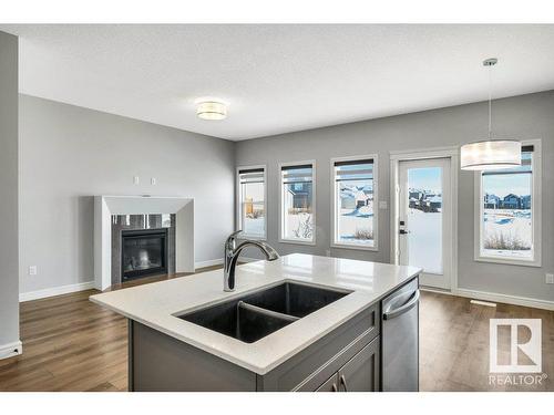 4787 Kinney Road, Edmonton, AB - Indoor Photo Showing Kitchen With Fireplace With Double Sink