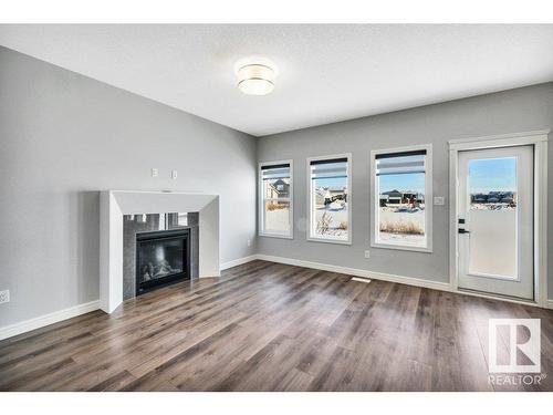 4787 Kinney Road, Edmonton, AB - Indoor Photo Showing Living Room With Fireplace