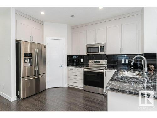 9162 Cooper Crescent, Edmonton, AB - Indoor Photo Showing Kitchen With Double Sink