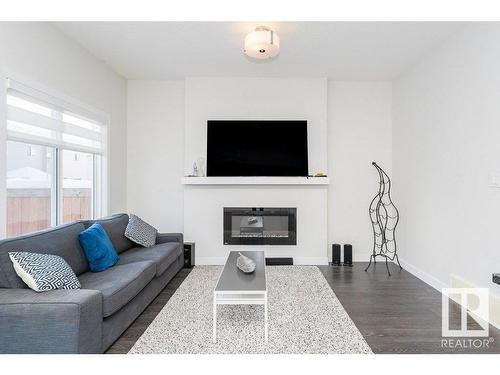 9162 Cooper Crescent, Edmonton, AB - Indoor Photo Showing Living Room With Fireplace