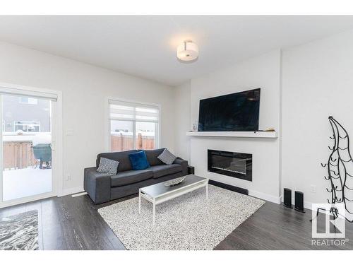 9162 Cooper Crescent, Edmonton, AB - Indoor Photo Showing Living Room With Fireplace