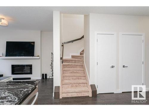 9162 Cooper Crescent, Edmonton, AB - Indoor Photo Showing Other Room With Fireplace