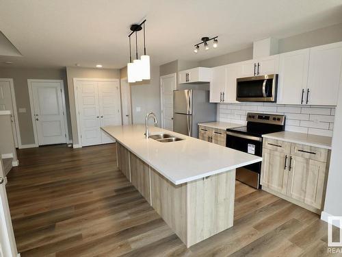 Upper 9357 Pear Link Link, Edmonton, AB - Indoor Photo Showing Kitchen With Double Sink With Upgraded Kitchen