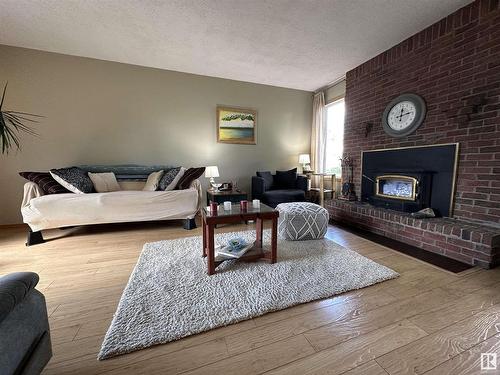 4417 Lakeshore Drive, Bonnyville Town, AB - Indoor Photo Showing Living Room With Fireplace