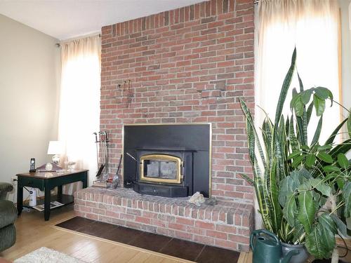 4417 Lakeshore Drive, Bonnyville Town, AB - Indoor Photo Showing Living Room With Fireplace