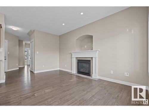 71 Elm Street, Fort Saskatchewan, AB - Indoor Photo Showing Living Room With Fireplace