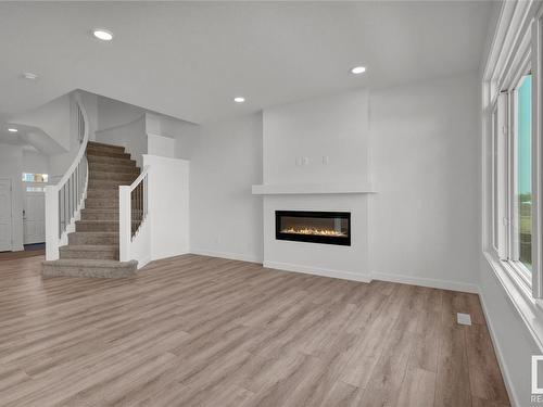 3449 Craig Landing, Edmonton, AB - Indoor Photo Showing Living Room With Fireplace