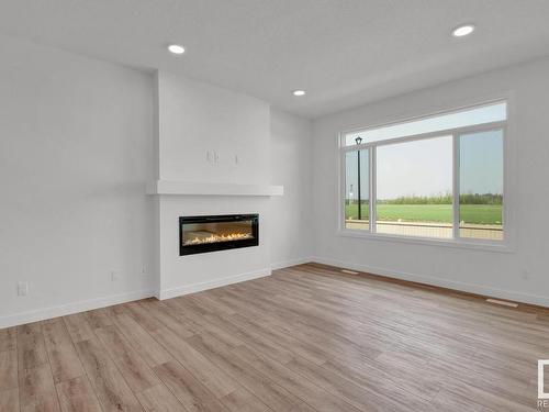 3449 Craig Landing, Edmonton, AB - Indoor Photo Showing Living Room With Fireplace