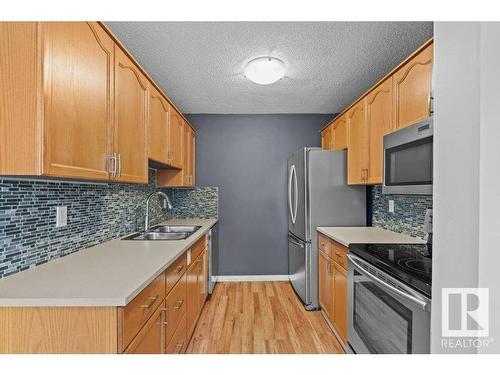 3139 139 Avenue, Edmonton, AB - Indoor Photo Showing Kitchen With Stainless Steel Kitchen With Double Sink