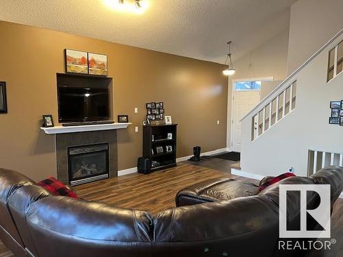 44 Birchmont Drive, Leduc, AB - Indoor Photo Showing Living Room With Fireplace