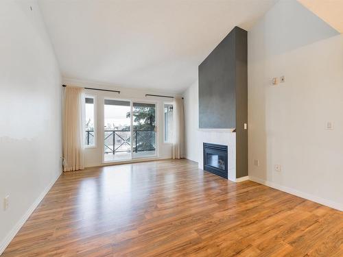 417 8912 156 Street, Edmonton, AB - Indoor Photo Showing Living Room With Fireplace